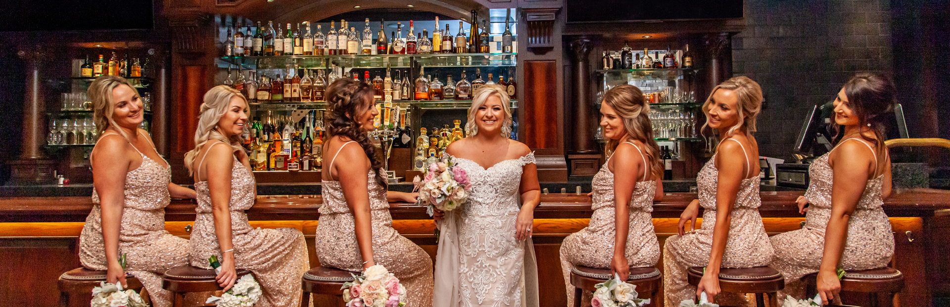 Bridesmaids taking a picture at the bar