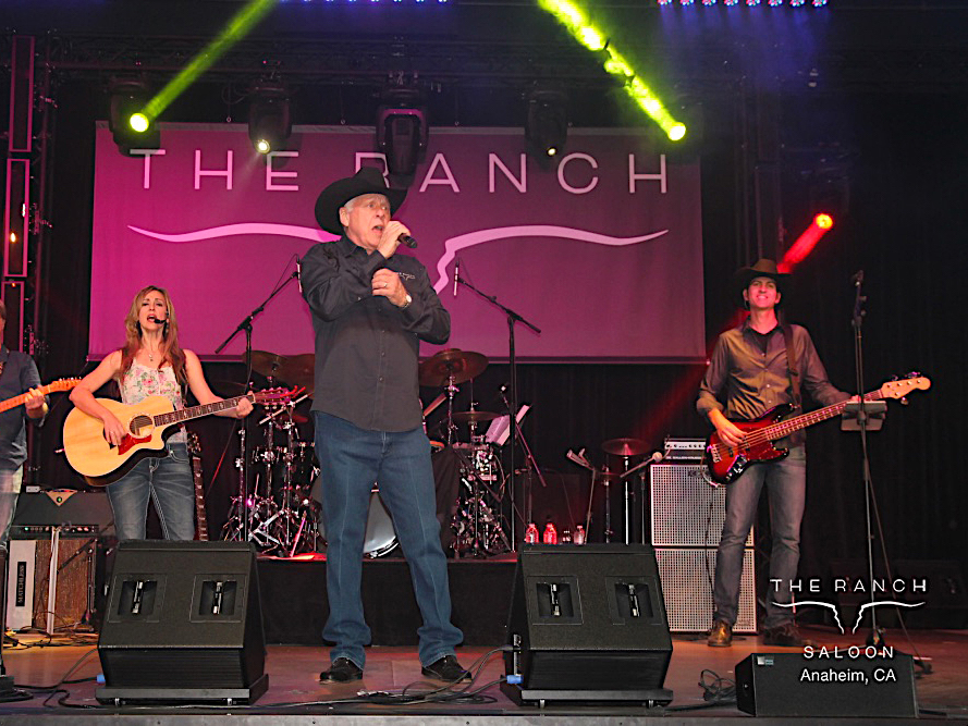 Owner of The RANCH, Andrew Edwards, on stage with The Kellye Huff Band.