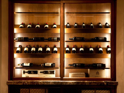 A wine cabinet containing various bottles of wine.